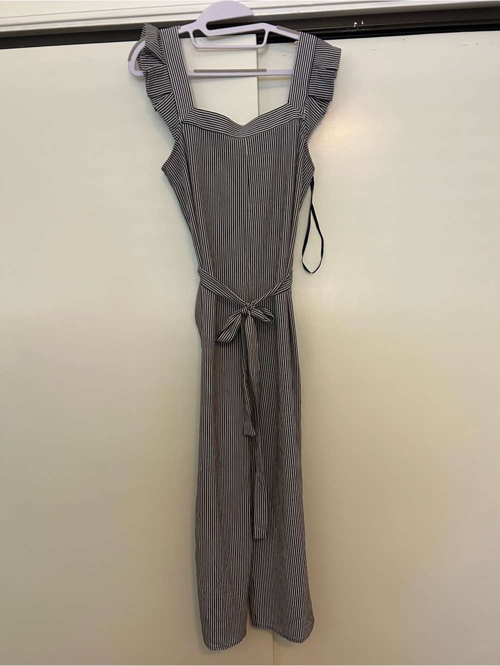 Navy and white striped ruffle sleeve jumpsuit with pockets